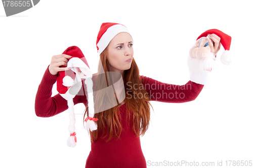Image of smiling young woman at christmastime in red clothes isolated