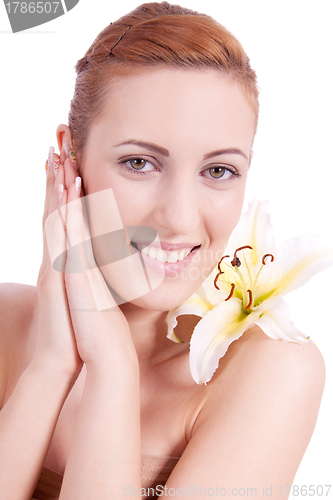 Image of beautiful natural woman face with flower isolated 