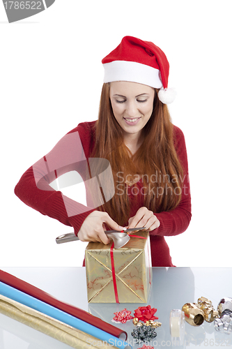 Image of young woman is packing  present for christmas isolated