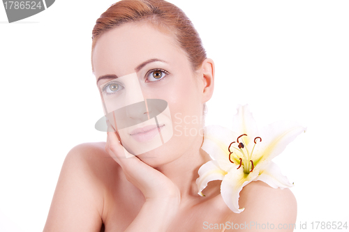 Image of beautiful natural woman face with flower isolated 