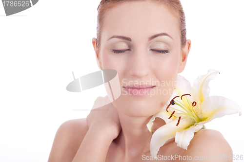 Image of beautiful natural woman face with flower isolated 