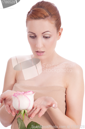 Image of beautiful young woman holding pink rose isolated
