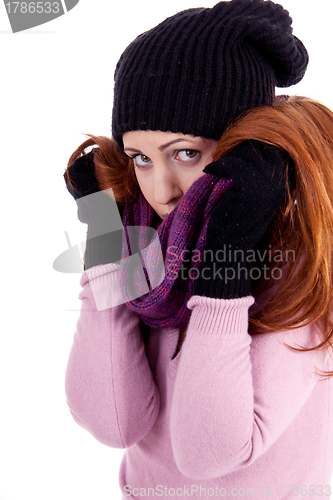 Image of young beautiful woman with hat gloves and scarf in winter isolated