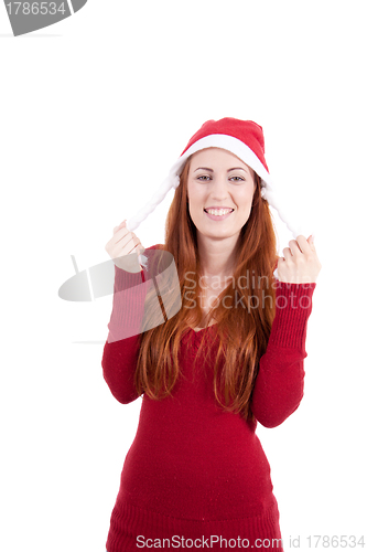 Image of smiling young woman at christmastime in red clothes isolated