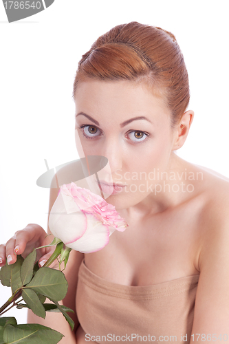 Image of beautiful young woman holding pink rose isolated