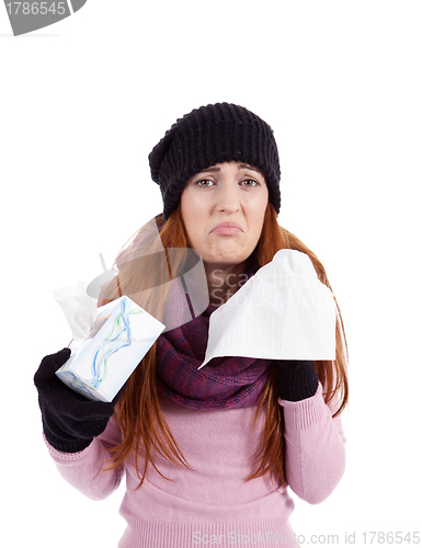 Image of woman with tissue and spray feels unwell with flu