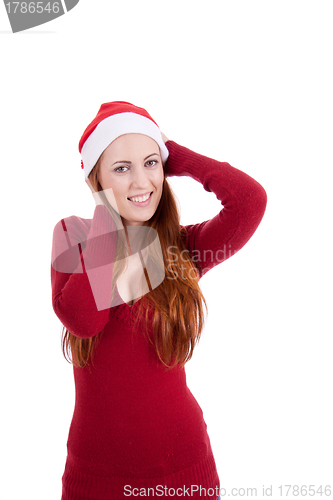 Image of smiling young woman at christmastime in red clothes isolated