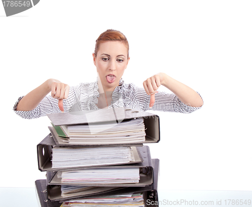 Image of business woman in office looks at unbelievable folder stack