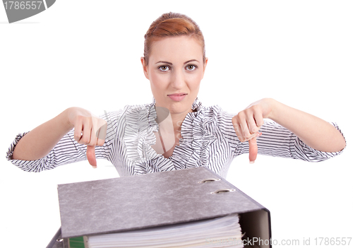 Image of business woman in office looks at unbelievable folder stack