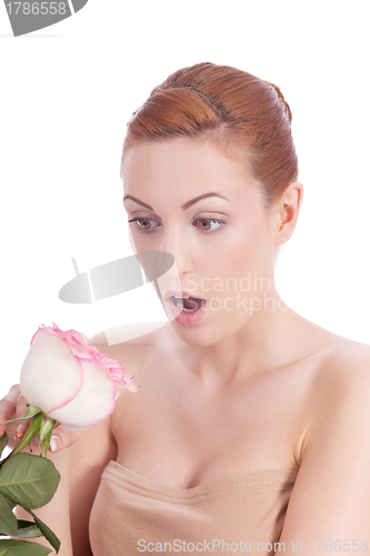 Image of beautiful young woman holding pink rose isolated