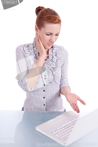 Image of young business woman on computer with snack isolated 