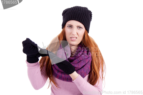 Image of young beautiful woman with hat gloves and scarf in winter isolated