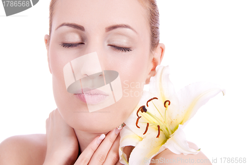 Image of beautiful natural woman face with flower isolated 