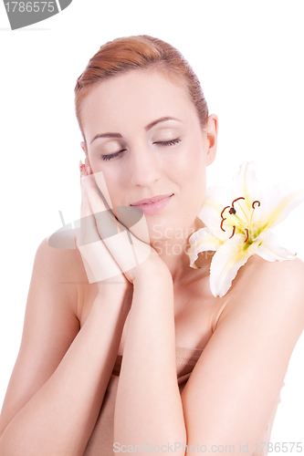 Image of beautiful natural woman face with flower isolated 
