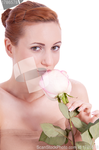 Image of beautiful young woman holding pink rose isolated
