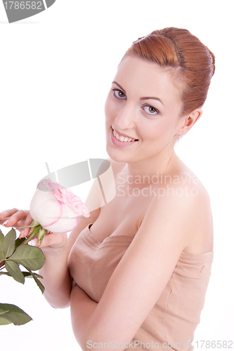 Image of beautiful young woman holding pink rose isolated