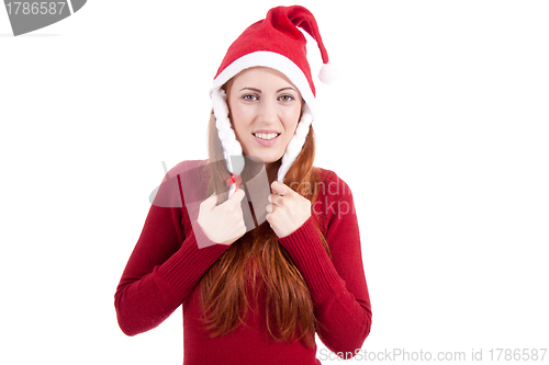 Image of smiling young woman at christmastime in red clothes isolated