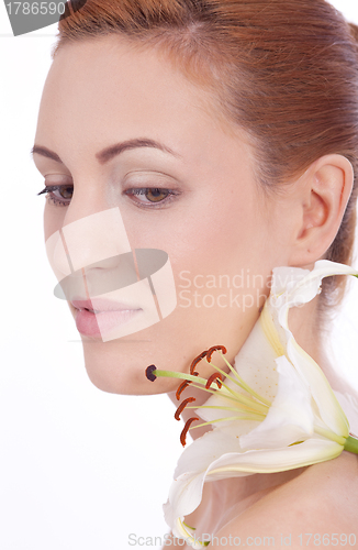 Image of beautiful natural woman face with flower isolated 