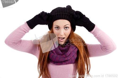 Image of young beautiful woman with hat gloves and scarf in winter isolated