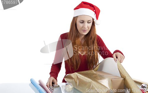 Image of young woman is packing  present for christmas isolated