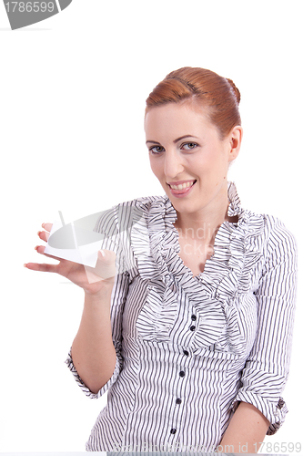 Image of beautiful young girl is holding a blank card in hand isolated