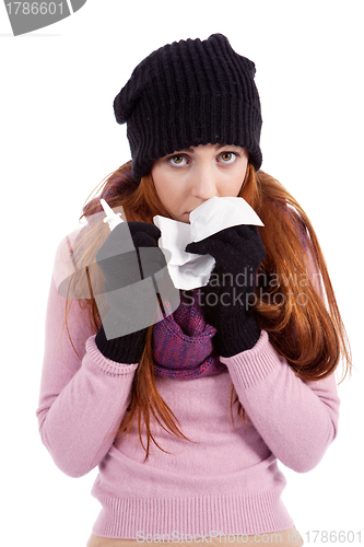 Image of woman with tissue and spray feels unwell with flu