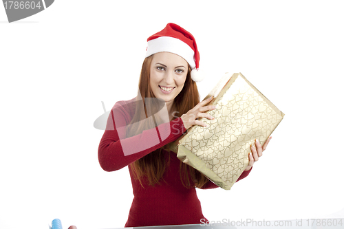 Image of young woman is packing  present for christmas isolated