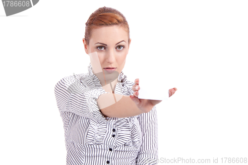 Image of beautiful young girl is holding a blank card in hand isolated