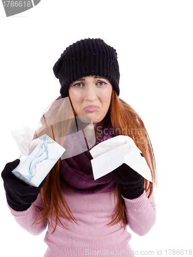 Image of woman with tissue and spray feels unwell with flu