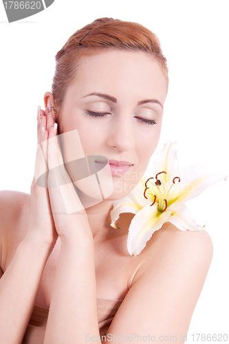 Image of beautiful natural woman face with flower isolated 