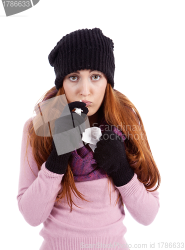 Image of woman with tissue and spray feels unwell with flu