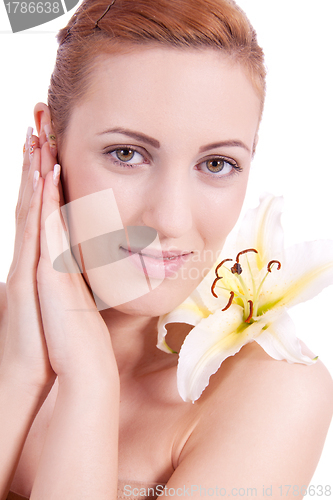 Image of beautiful natural woman face with flower isolated 