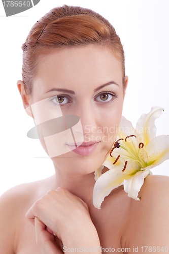 Image of beautiful natural woman face with flower isolated 