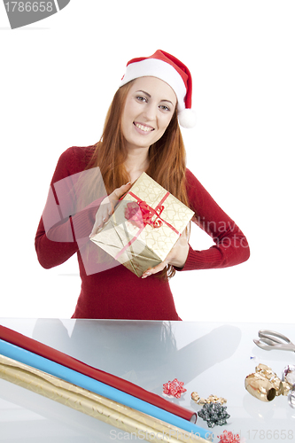 Image of young woman is packing  present for christmas isolated