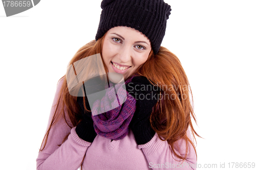 Image of young beautiful woman with hat gloves and scarf in winter isolated