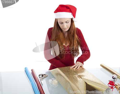 Image of young woman is packing  present for christmas isolated