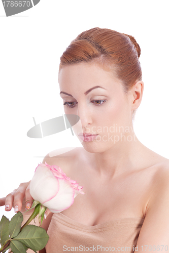 Image of beautiful young woman holding pink rose isolated