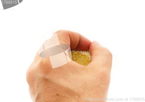 Image of fresh half lemon on hand