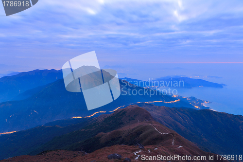 Image of mountain at night with road