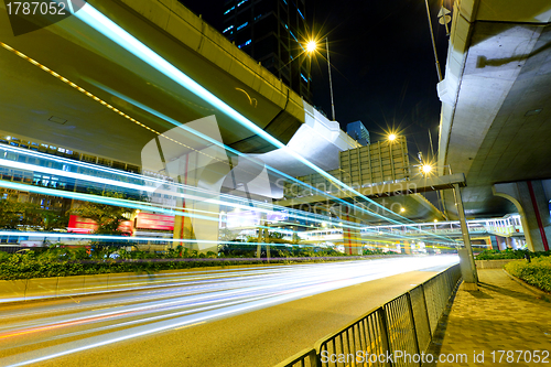 Image of traffic with blur light through city at night