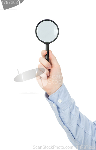 Image of  hand holding magnifying glass
