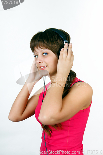 Image of attractive young girl listening to music