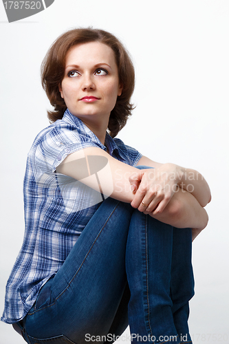 Image of girl in a plaid shirt and jeans