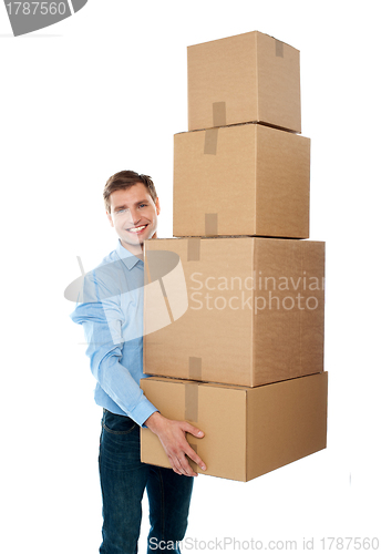 Image of Handsome male with with stack of boxes