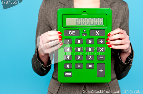 Image of Hands of a businesswoman showing calculator