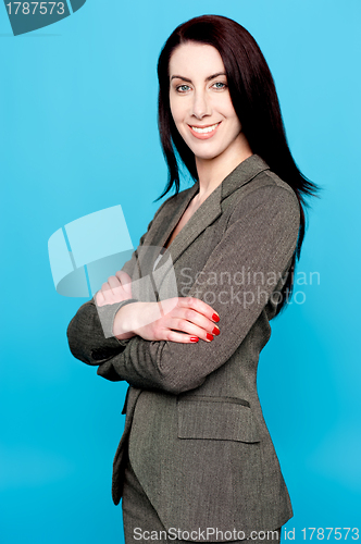 Image of Attractive woman standing with crossed arms