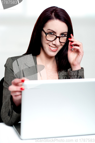 Image of Corporate lady about to shutdown laptop