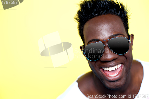 Image of Closeup of joyful young african guy in sunglasses
