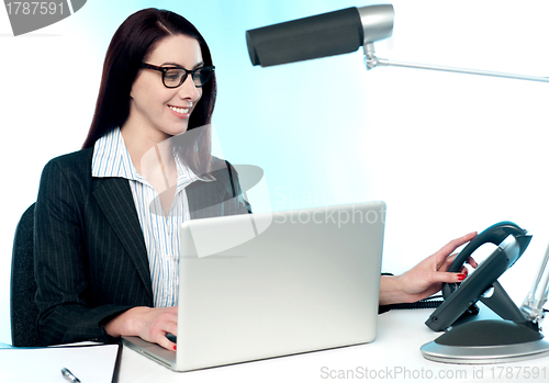 Image of Female secretary answering phone call