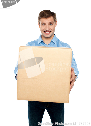 Image of Charming handsome male holding carton